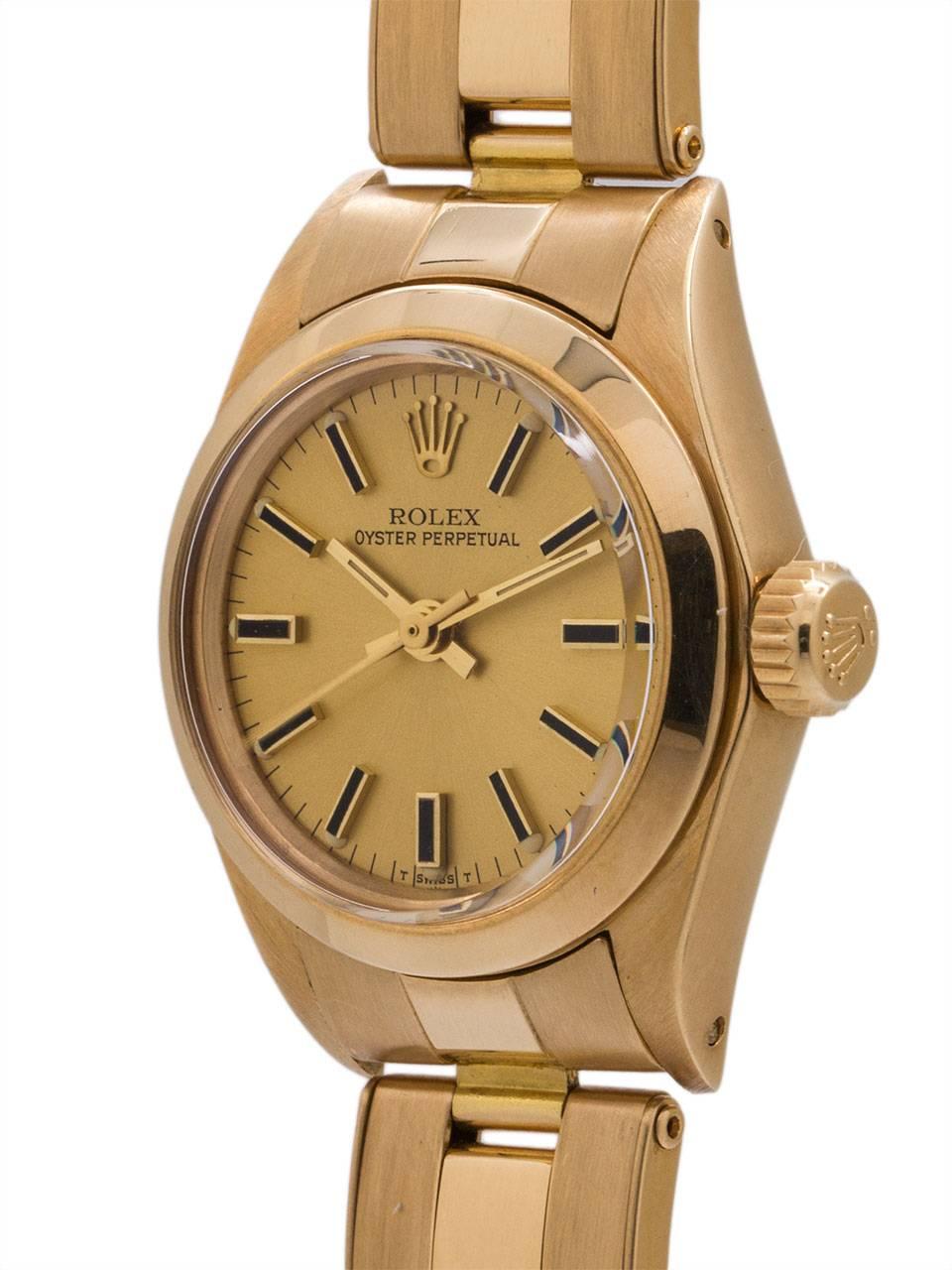 
Lady Rolex Oyster Perpetual 18K YG ref# 6718 serial #4.1 million circa 1976. Featuring 25 mm diameter Oyster case with smooth dome bezel, acrylic crystal, and beautiful condition original champagne dial with applied gold indexes and gilt baton