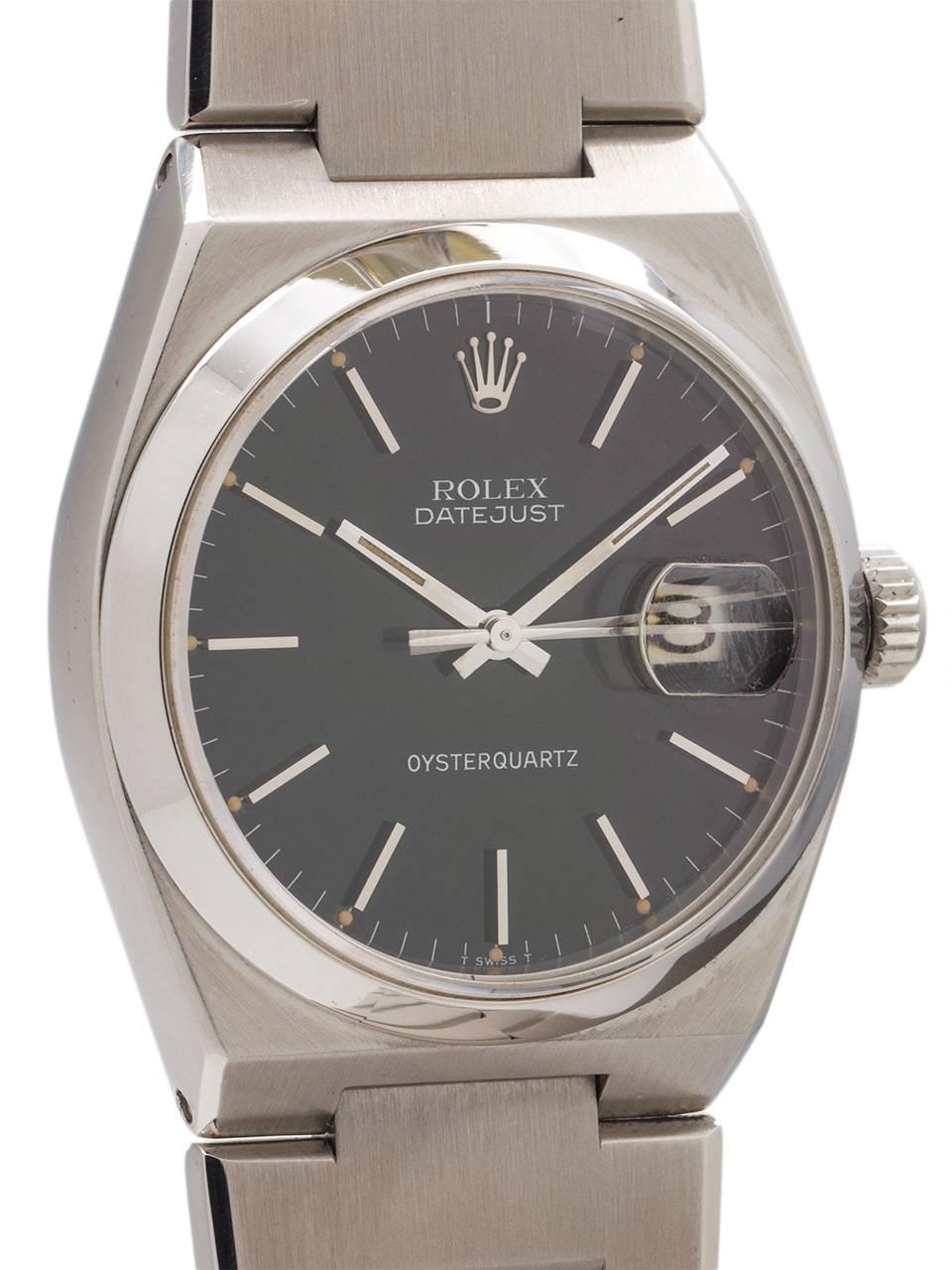 
Rolex Stainless Steel Datejust Oyster Quartz ref 17000 serial # 5.5 million circa 1978. Featuring a 36mm diameter case with smooth bezel, sapphire crystal, and scarce original gloss black dial with applied silver indexes and silver baton hands.