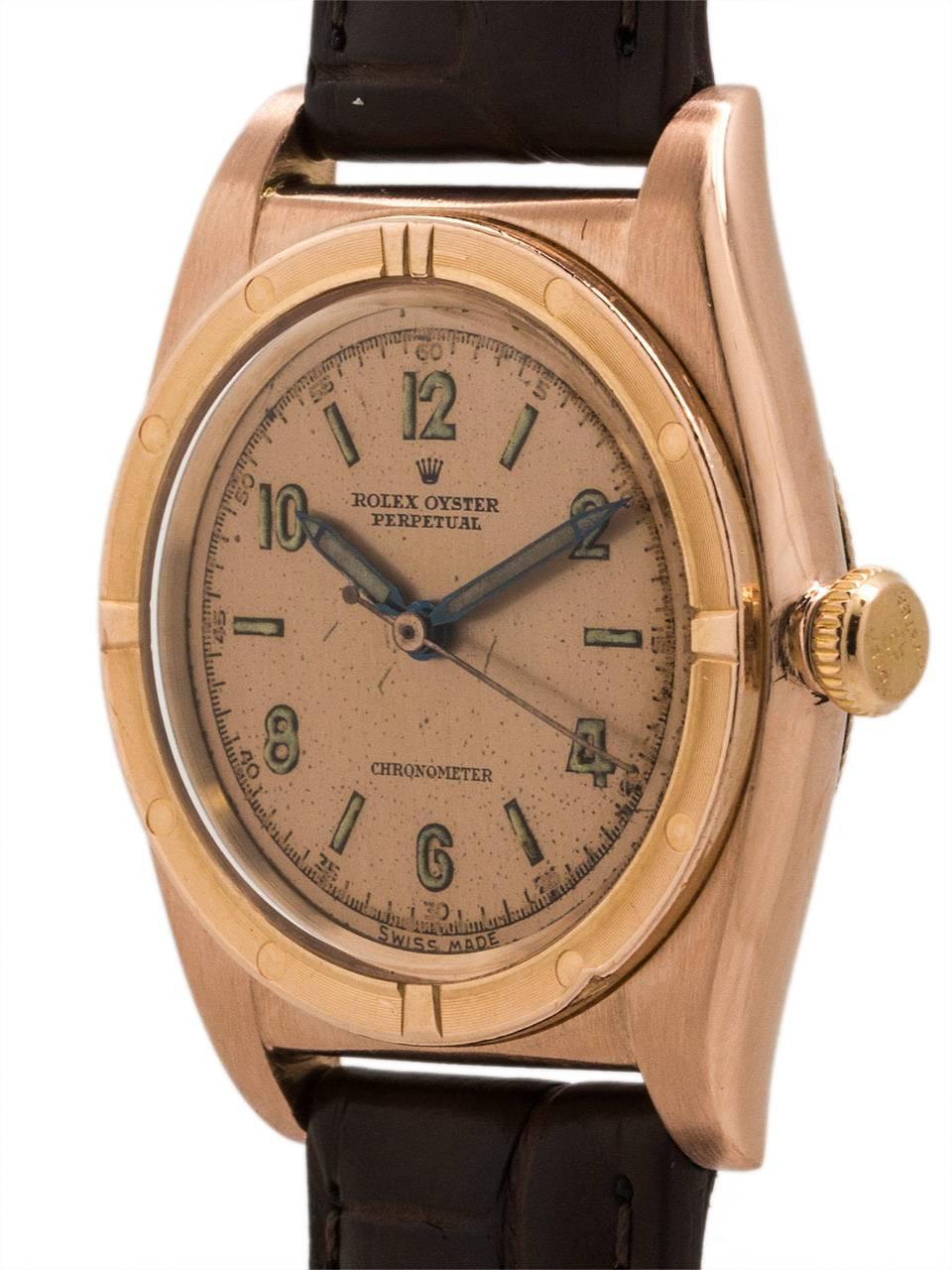 
A Christmas present from 69 years ago, could be a Christmas present again! Rolex 14K PG Bubbleback ref 3372 serial # 495,xxx circa 1947. Featuring a 32mm diameter tonneau shaped Oyster case with fine engine turned bezel, acrylic crystal, original