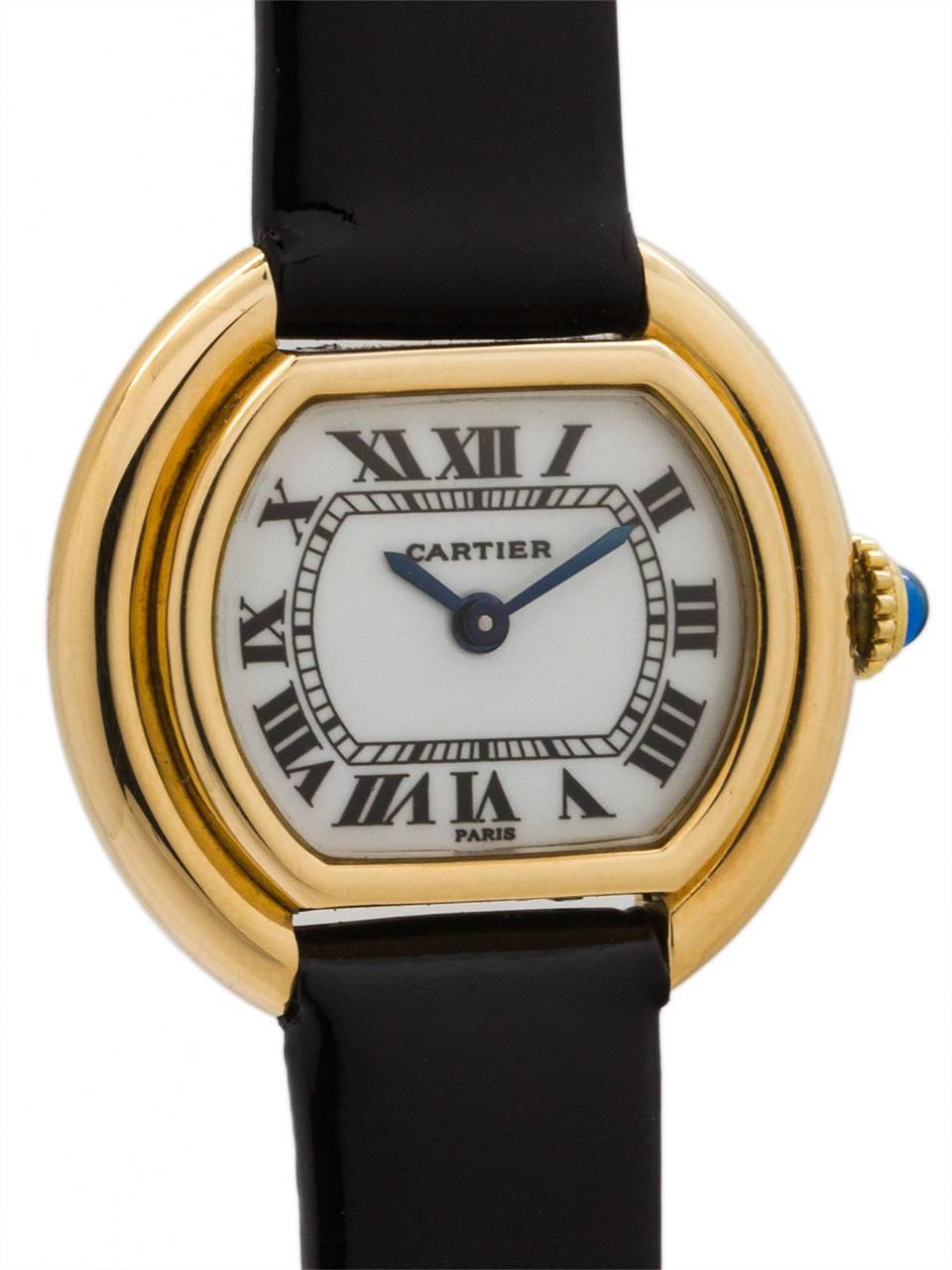 
Cartier 18K YG lady Vendome model, 24mm x 26mm, circa 1970’s. Scarce and great looking tonneau shaped case with stepped and grooved sides. With mineral glass crystal and rare white “baked” enamel classic Cartier dial with Roman figures and blued