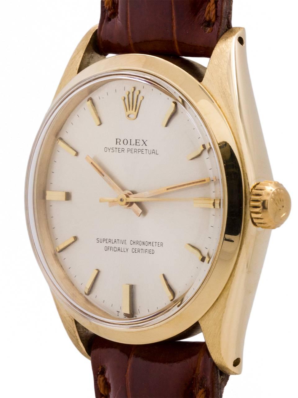 
Rolex 14K YG Oyster Perpetual ref 1005 serial # 1.0 million circa 1965 complete with original box and large chronometer certificate. Featuring a 34m diameter case with smooth bezel and acrylic crystal and original silvered satin dial with gold