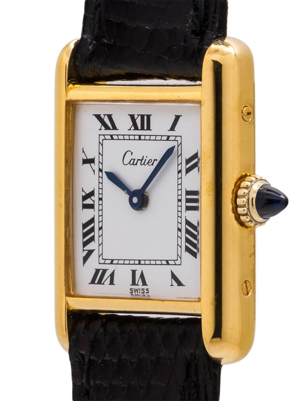 
An early pre “Must de Cartier” Cartier Lady’s Tank Louis circa 1970’s with popular white Roman dial signed Cartier. This model features a 20.5 X 28mm gold plated (not Vermeil) case secured by 4 screws and is powered by a 17 jewel manual wind