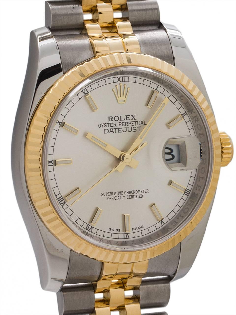 
Rolex SS/18K YG Datejust ref # 116203 random serial # with engraved inner bezel circa 2010+.  Featuring newer more robust design 36mm diameter case with smooth domed bezel, sapphire crystal, and silvered satin dial with large gold applied luminova