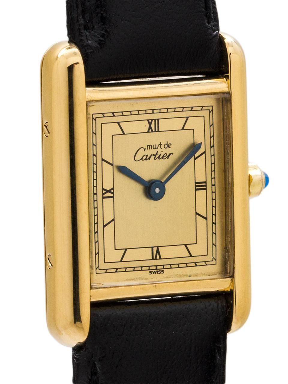 
Cartier Lady's Vermeil Tank Louis Must de Cartier, circa 1990's. Vermeil, 20 microns gold over silver, 22 X 29mm case secured by 4 side screws and 4 case back screws. Featuring an original cream color dial with fine Roman figures and blued steel