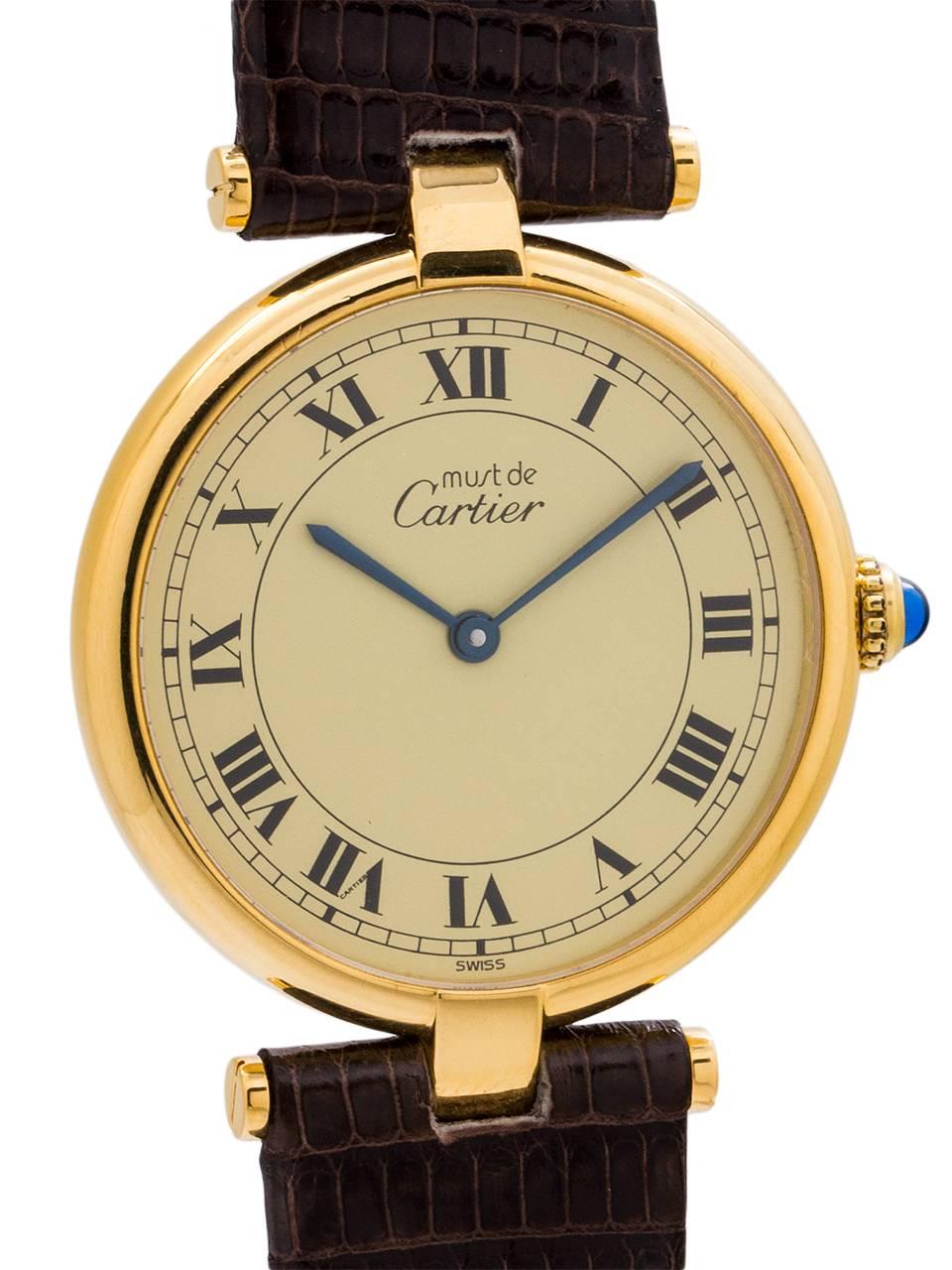 
Cartier man’s vermeil Vendome Tank wristwatch circa 1990s. Case measuring 30.5 x 37mm with T-bar lugs. Featuring an original cream dial with classic printed Cartier Roman numbers with blued steel hands and blue sapphire cabochon crown. Battery