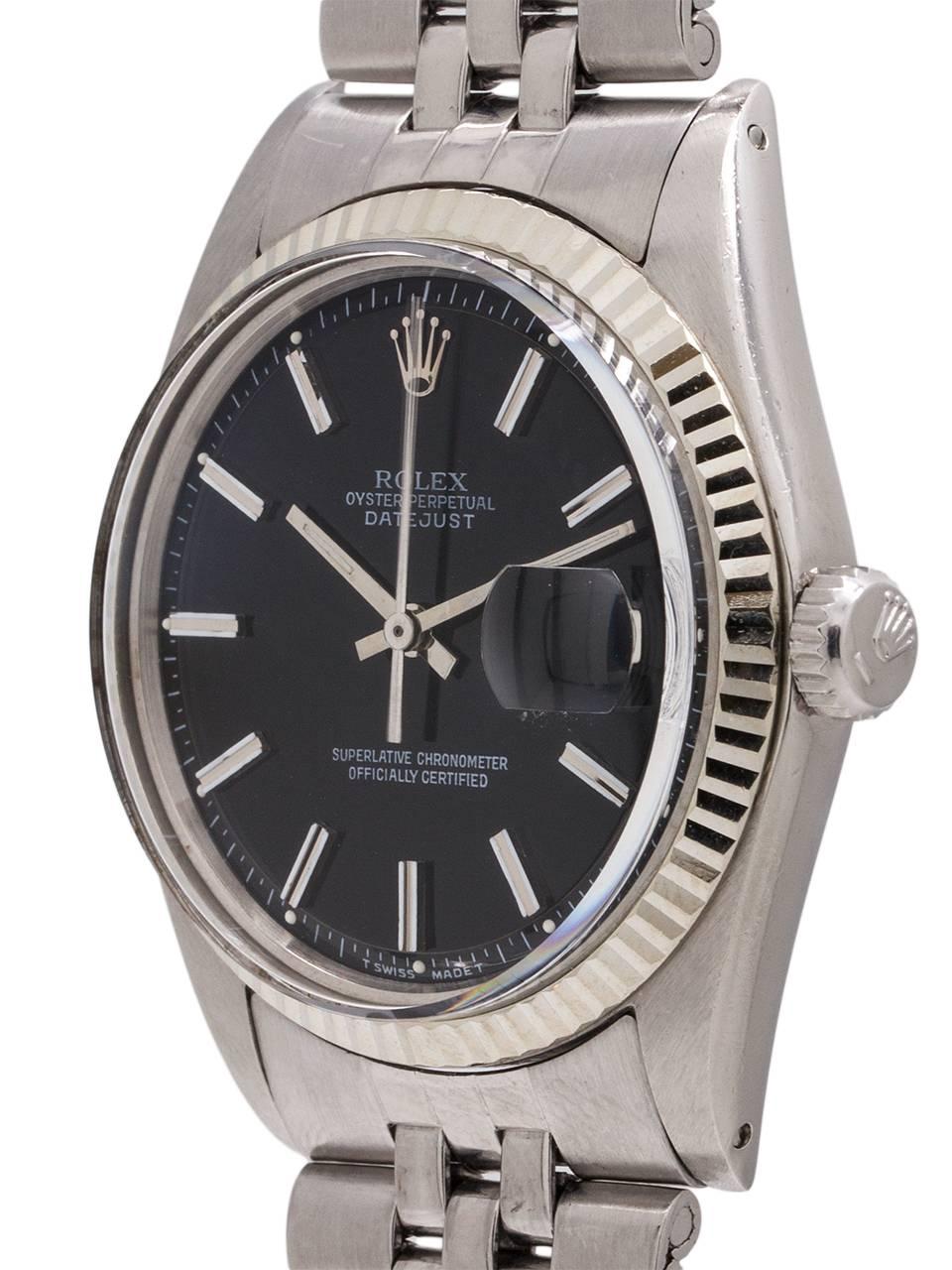 
Vintage Rolex Datejust ref 1601 serial # 5.2 million circa 1977. Featuring 36mm diameter Oyster case with 14K white gold fluted bezel, acrylic crystal, and original glossy black pie pan dial with applied silver indexes and silver baton hands.
