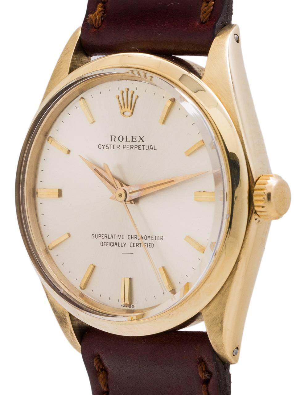 Very pleasing example Rolex 14K YG Oyster Perpetual ref 1002 serial # 1.01 million circa 1964. Featuring a 34m diameter case with smooth bezel and acrylic crystal and original silvered satin “underline” dial with early style tapered gold applied