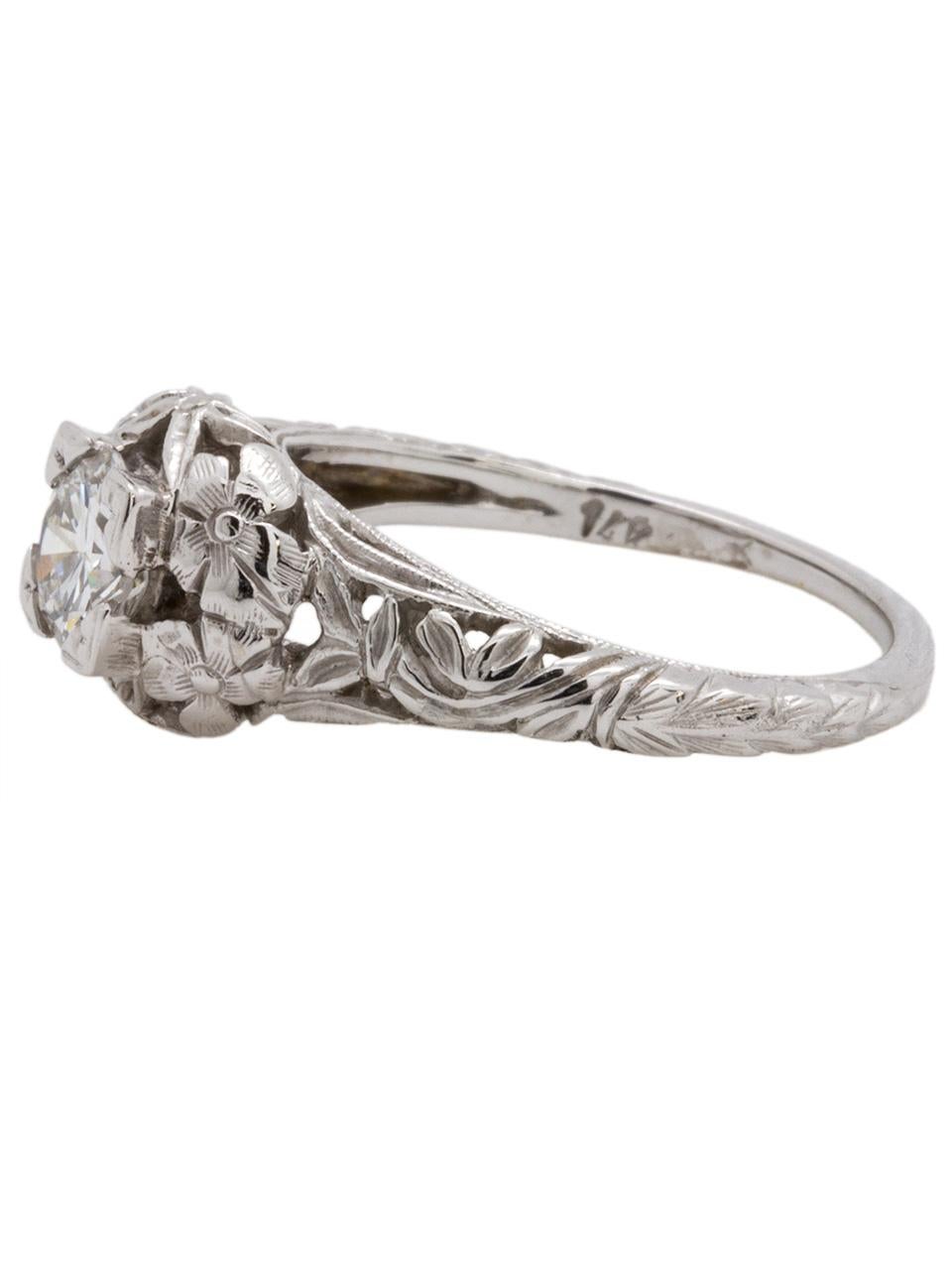 
Beautiful, vintage style modern 14K white gold floral engraved solitaire engagement ring set with 0.53ct round brilliant cut diamond with exceptional E color (colorless) and VS2 clarity. Gorgeous detailed carved flower design with wheat grain