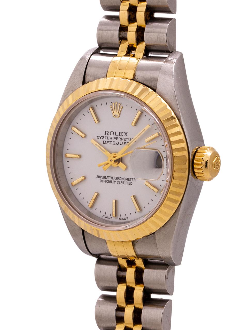 Lady Rolex Datejust stainless steel and 18k yellow gold ref# 79173 26mm diameter case with 18K gold fluted bezel, sapphire crystal, and original white dial with applied gold stick numerals circa 1998. Powered by self winding movement with sweep