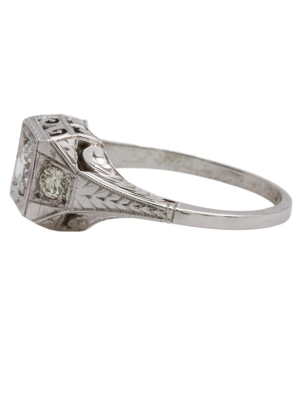 Beautiful 18k white gold  diamond engagement ring manufactured by “Belais” set with 0.37ct  round brilliant center diamond, H-VS2. Fantastic angular design setting with filigree and wheat pattern engraved detail, milgrain edging and scalloped side