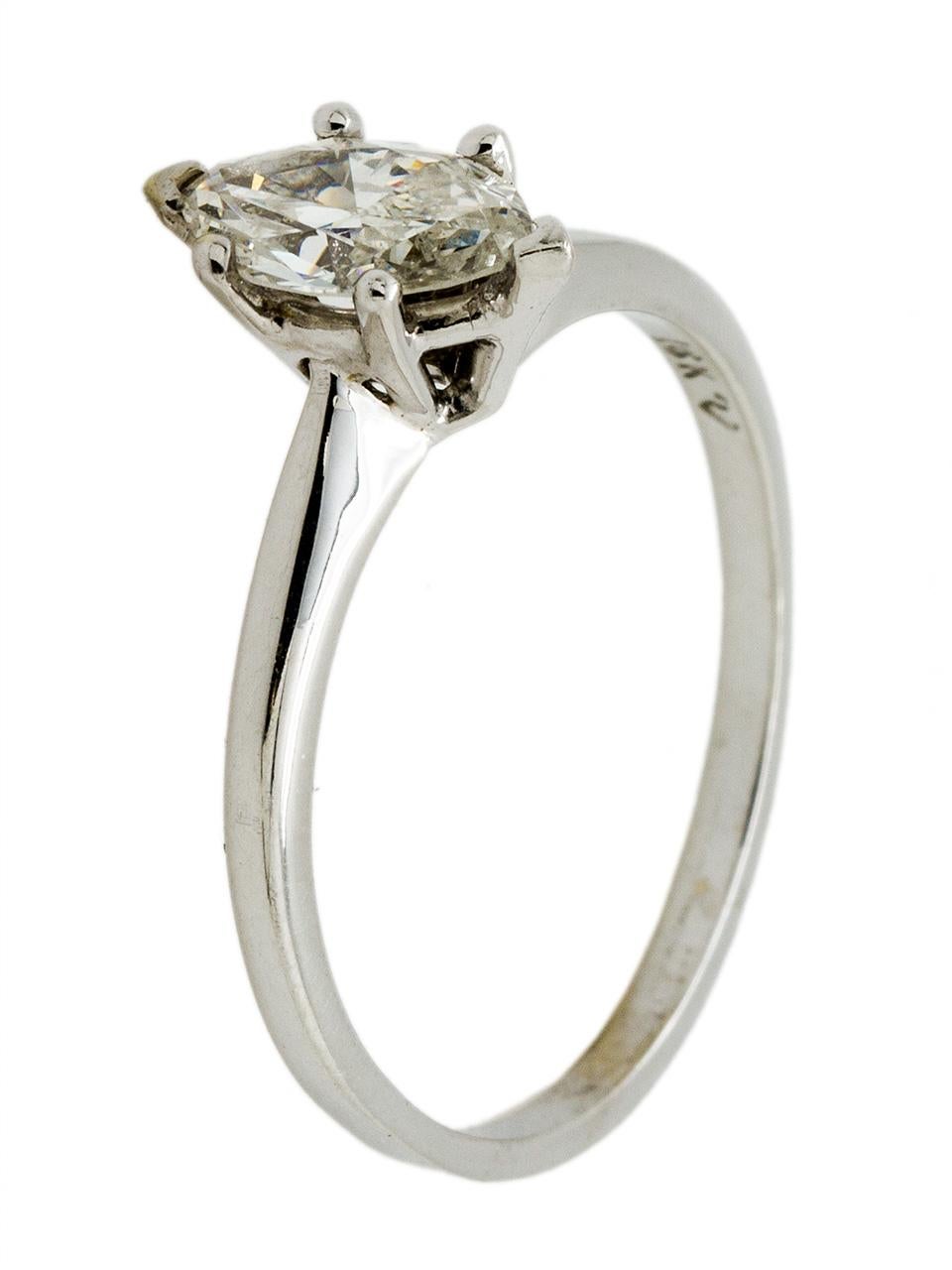 Lovely 18k white gold solitaire engagement ring with .58ct marquise cut center diamond, I color/SI1 clarity. Set in a classic 1960s mounting with a softly beveled shank, this timeless ring would be perfectly complimented by one of our vintage