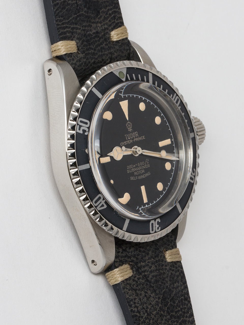 Tudor Stainless Steel Submariner Wristwatch ref 7928 serial #379,XXX circa 1962. Measuring 39.5mm diameter case with rotating elapsed time bezel and pointy crown guards. With beautifully refinished glossy black minute track dial with patina'd