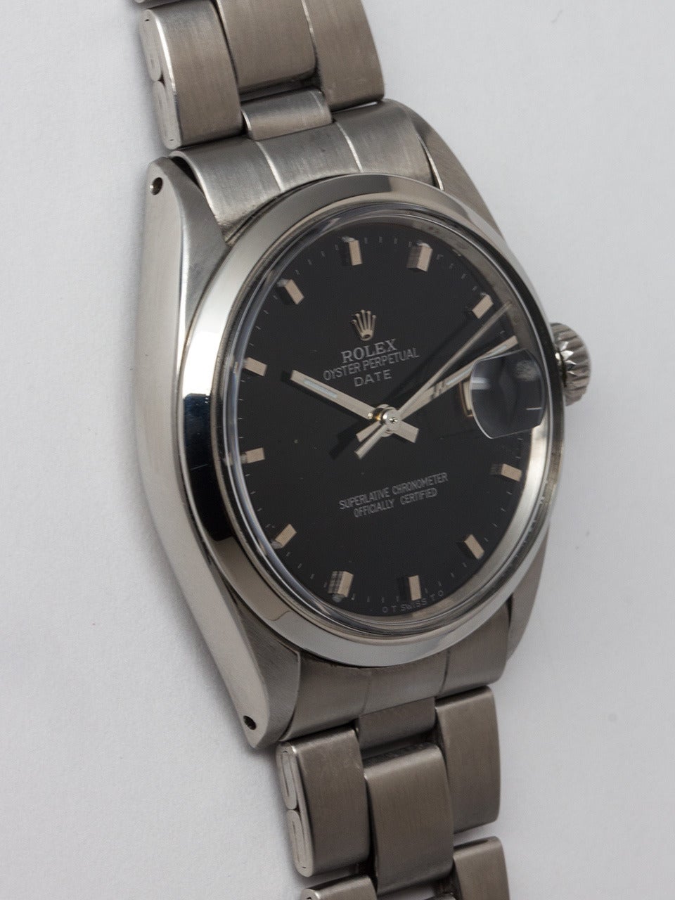 Rolex Stainless Steel Oyster Perpetual Date Wristwatch ref 1500 serial #2.2 million circa 1969. 34mm diameter case with smooth bezel and acrylic crystal. Glossy black dial with applied silver square indexes and hands. Powered by self winding