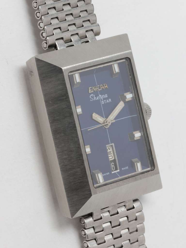Enicar stainless steel Sherpa Star rectangular automatic wristwatch with day and date and original signed bracelet. Featuring rectangular 26x38mm case with sapphire crystal, original blue dial with applied luminous indexes, cross hair pattern, with
