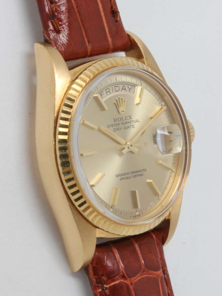 Rolex 18k yellow gold Day-Date wristwatch, Ref. 1803, serial number 4.1 million, circa 1975. 36mm full-size man's model with fluted bezel, acrylic crystal and original champagne pie pan dial with applied indexes and gold baton hands. Calibre 1556