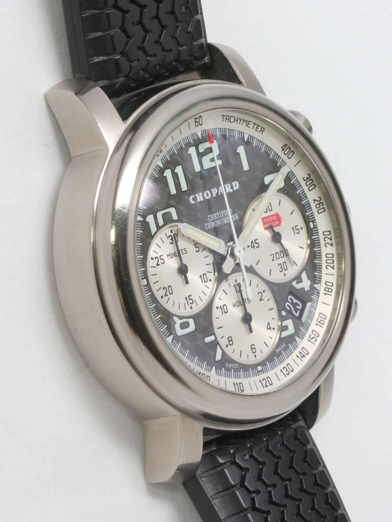 Chopard titanium Mille Miglia chronograph wristwatch with date on rubber strap. In original box, with tags and documentation. Papers dated 2000.

Beautiful carbon fiber dial, automatic movement with date and display back. On original unworn black