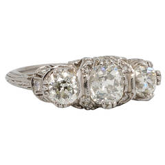 1920
s Three-Stone Old Mine Cut Diamond and Platinum Ring 1920
s Three-Stone Old Mine Cut Diamond and Platinum Ring