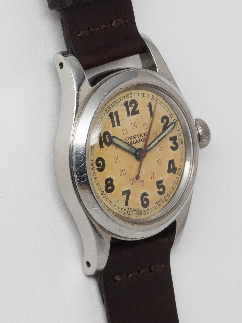 Rolex Oyster Raleigh Wristwatch serial # 177,xxx circa 1944. 31mm boy's size model with original period Oyster Patent crown. Very pleasing original lightly patina'd 24 hour luminous dial with luminous Arabic figures, inner red military 24 hour