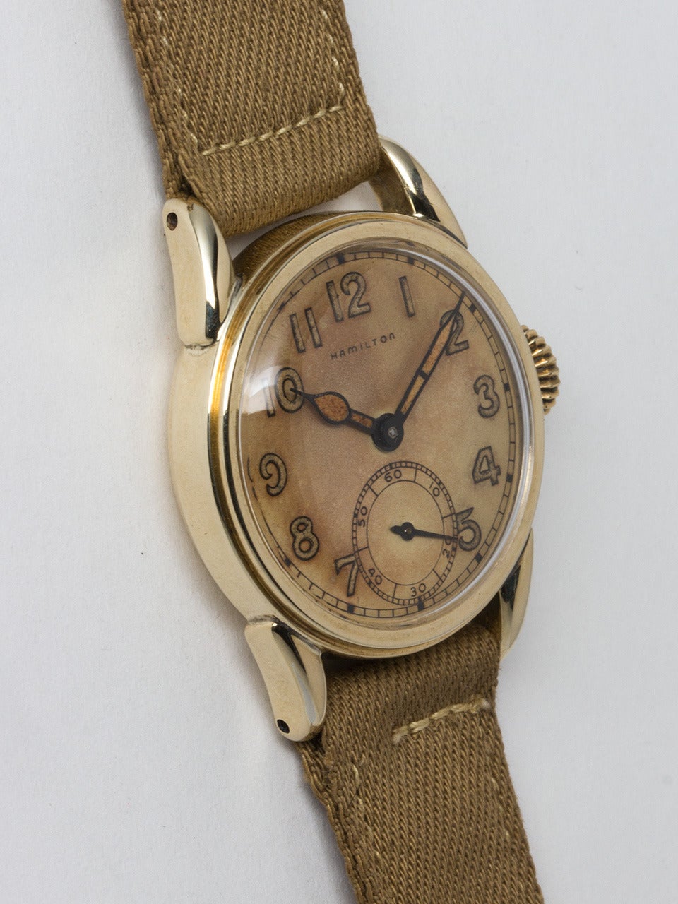Hamilton Yellow Gold Filled Military Style Wristwatch circa 1940s. 29 x 36mm snap back case, very pleasing richly patina'd luminous arabic figures dial and hands. 17 jewel manual wind calibre 987A movement with subsidiary seconds. Fitted with new
