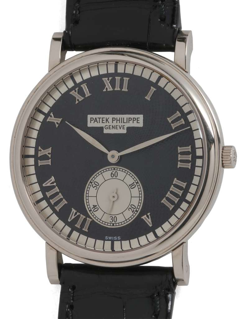 Patek Philippe 18k white gold wristwatch, Ref. 5022G, circa 1990s. Beautiful black waffle dial with contrasting silvered outer track and large silvered subsidiary seconds as well as raised silvered plaque bearing Patek Philippe signature. Classic