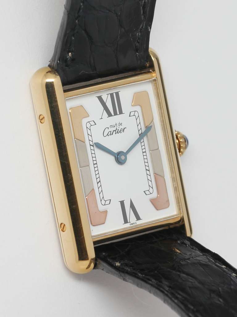 Cartier man's gilt silver Tank Louis Must de Cartier wristwatch, circa 1990s. Vermeil, 20 microns gold over silver, case with back secured by screws in the sides. With unusual white dial with tri-tone markers of yellow, white and pink hues and large