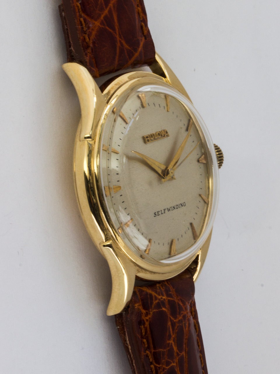 Bulova 14K Yellow Gold Self Winding Wristwatch serial #8.1 million circa 1950s. 34mm diameter case with acrylic crystal and signed Bulova crown. Silvered satin dial with applied gold arrowhead indexes and hands. Powered by self winding automatic