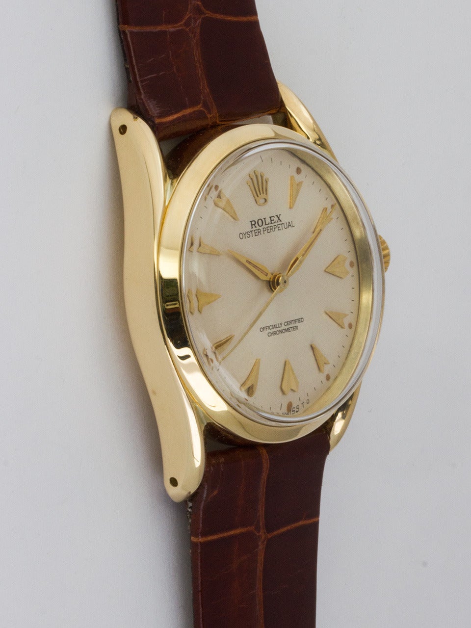 Rolex 14K Yellow Gold Oyster Perpetual Bombe ref 1010 serial 741,xxx circa 1952. 34mm diameter Oyster case with smooth bezel and acrylic crystal. Beautiful condition original dial with applied gold arrowhead indexes and tapered sword hands. Powered