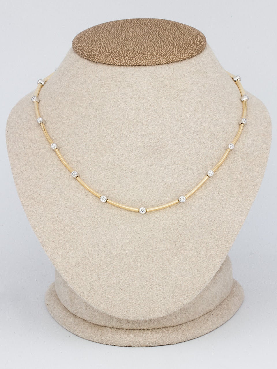 Tiffany & Co 18K yellow gold necklace designed as a series of molded bars connected by diamonds set in platinum bezels, approx 1.33ctw. Beautiful contemporary design. Necklace lies on the neck beautifully and  elegantly. You'll be ready for the
