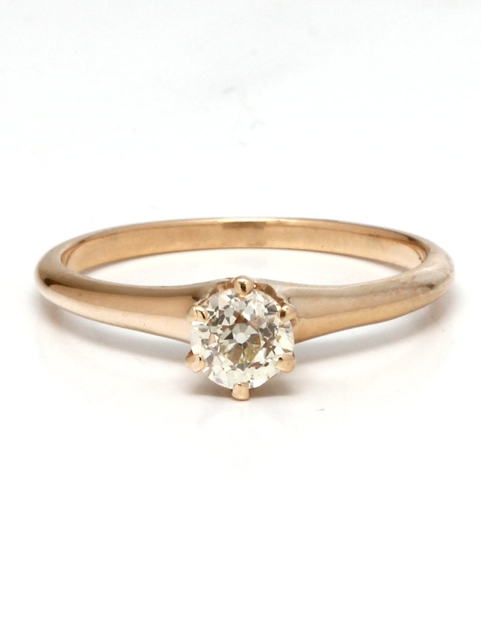 14K yellow gold solitaire with 0.59ct Old Mine Cut diamond, light fancy yellow color and VS2 clarity. Classic solitaire with 6 prong setting and fiery diamond. Perfect to stack with bands. Size 7.75 circa 1900's

As a special offering for our