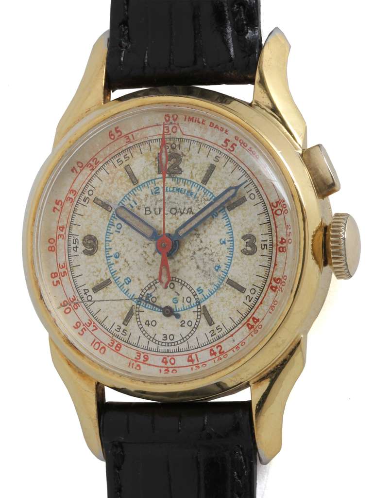 Bulova gilt silver single-button chronograph wristwatch, circa 1940s. Boy's size 29mm x 40mm snap back case. Gorgeous original patinaed silvered dial with colorful tachymetre and telemetre scales. On your choice of fine leather 12mm strap.

Like