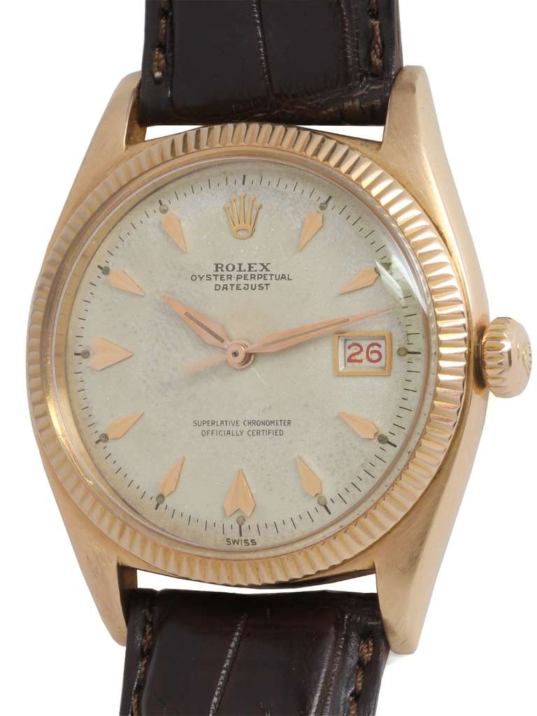 Rolex 18k rose gold early Datejust wristwatch, Ref. 6605, serial number 417,XXX, circa 1958. 36mm case with fine milled bezel, acrylic crystal, and beautiful condition original silvered dial with applied oversized tapered and faceted indexes, rose