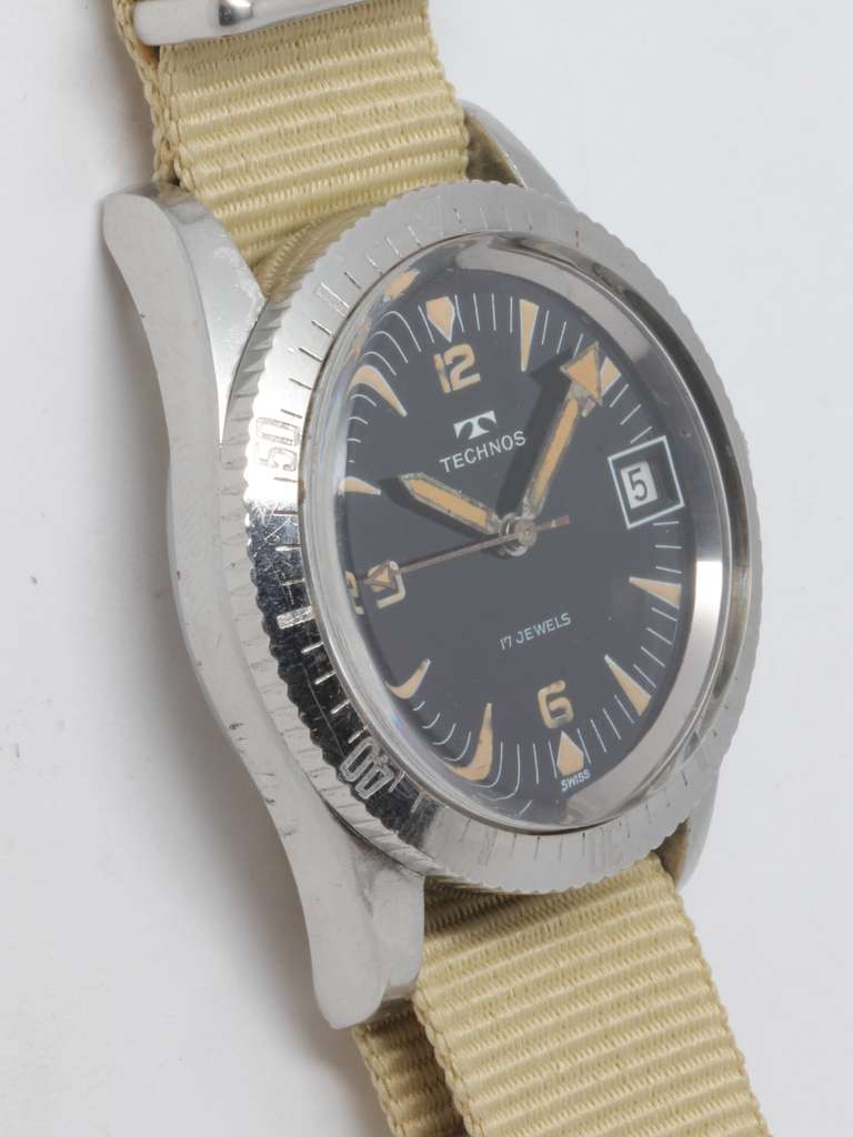 Technos stainless steel diver's wristwatch, circa 1960s. 36.5 X 44mm screw back case with steel elapsed time bezel and original glossy black dial with patinaed stylized luminous indexes and luminous hands with arrow-tipped minute and sweep seconds