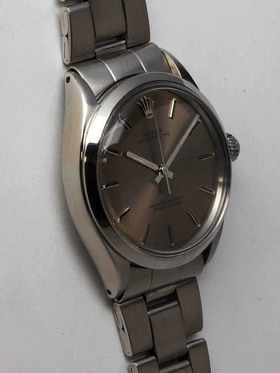 Rolex Stainless Steel Oyster Perpetual Wristwatch ref 1002 serial number 3.1 million circa 1971. 34mm diameter case with smooth bezel and acrylic crystal. Original gray dial with applied silver indexes and silver baton hands. Powered by self winding