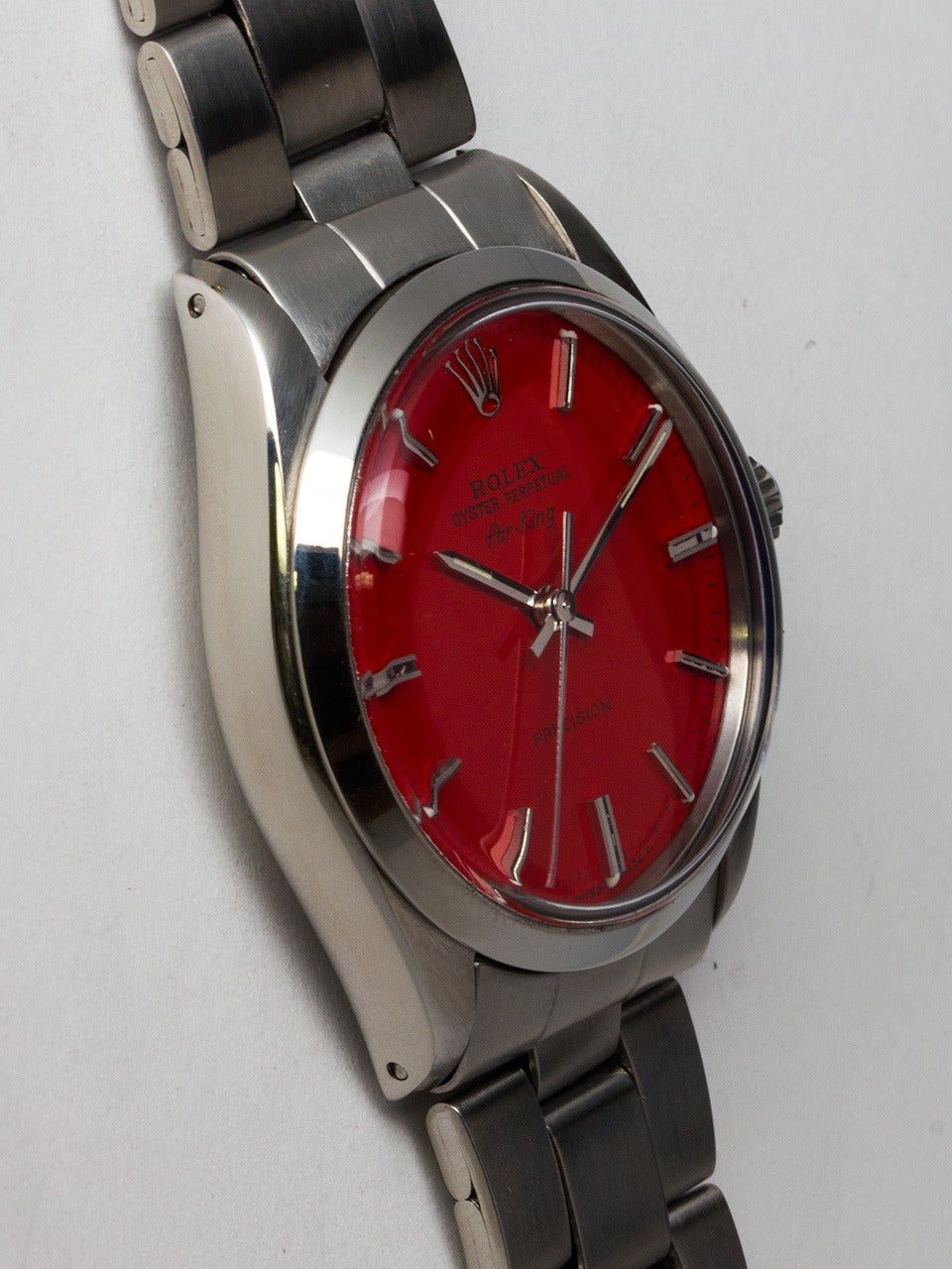 Rolex Stainless Steel Oyster Perpetual Airking Wristwatch, ref 5500 serial number R9 circa 1987. 34mm diameter case with smooth bezel and acrylic crystal. With custom colored Tomato Red dial with applied silver indexes and silvered baton hands.