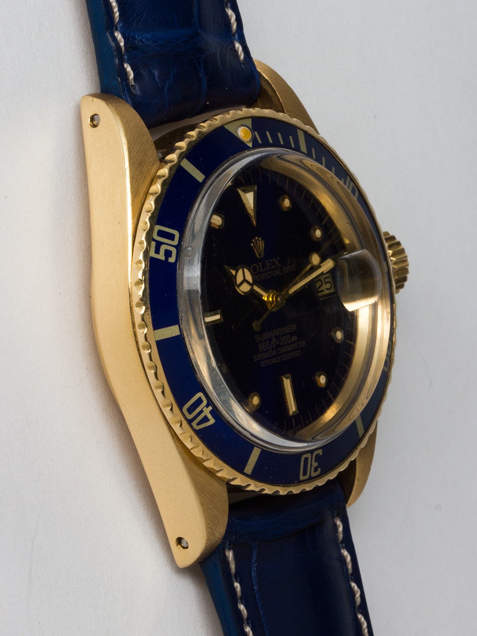 Rolex 18K Yellow Gold Submariner Wristwatch, ref 1680 serial number 5.8 million circa 1978. 40mm diameter case with bi-directional elapsed time bezel with original blue insert with antique color pearl and acrylic crystal. Great condition original