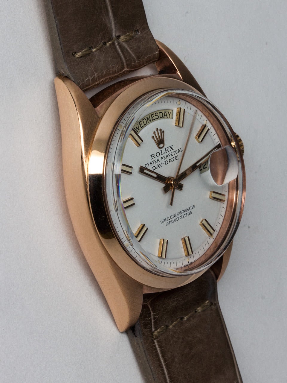 Rolex 18K Rose Gold Day-Date Wristwatch ref 1803 serial number 2.8 million circa 1971. 36mm diameter full size man's model with smooth dome bezel and acrylic crystal. Beautifully restored white dial with pink applied indexes and hands. Powered by