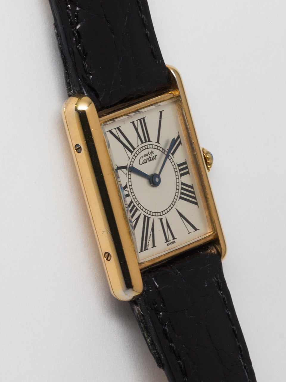 Cartier Man's Vermeil Tank Louis Must de Cartier, circa 1980s. Vermeil, 20 microns gold over silver, 23.5 X 31mm case secured by four screws. White dial signed Must de Cartier with exaggerated Roman numerals around bulls eye center and blued spade