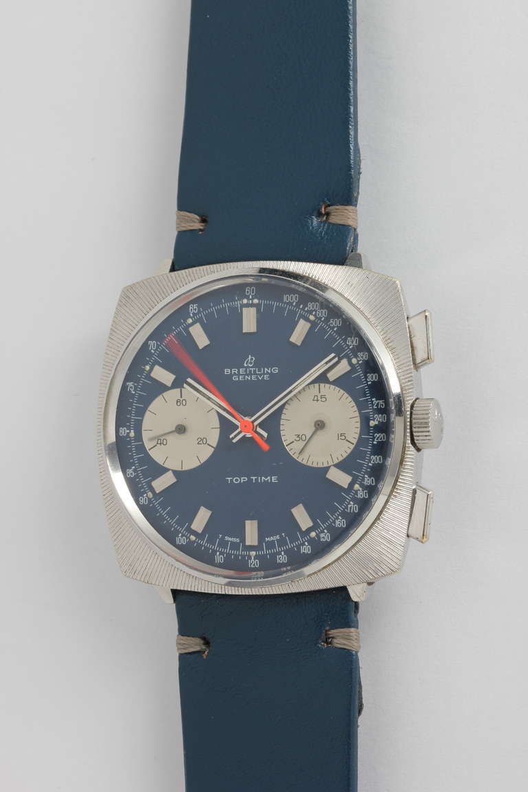 Breitling stainless steel Top Time cushion chronograph wristwatch, Ref. 2007/33 3, circa 1960s. 38mm wide case with textured surface, with beautiful original blue dial with silvered subsidiary dials, orange chronograph hand, calibre 7733 manual-wind