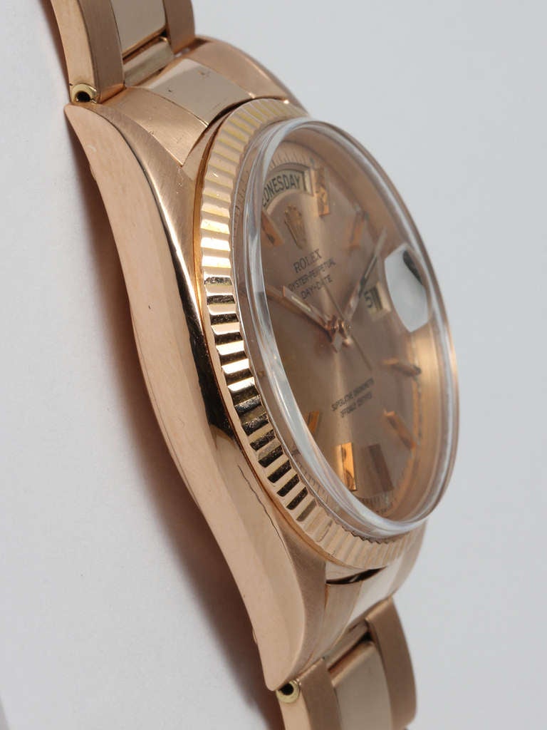 Rolex 18k rose gold Day-Date wristwatch, Ref. 1803, serial number 1.6 million, circa 1967. 36mm case with fluted bezel and acrylic crystal. With very beautiful original salmon pie-pan dial with applied pink indexes and pink baton hands, Rolex logo