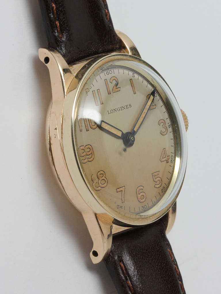 Longines yellow gold-filled wristwatch, circa 1940s. 35 X 39mm three-piece case with downturned lugs and sweep center seconds. With beautiful original patinaed dial, luminous indexes and luminous pencil hands. 17-jewel manual-wind calibre 12L