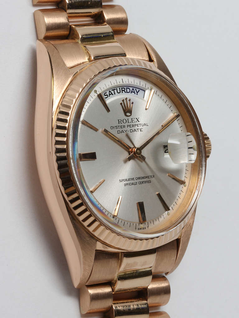 Rolex 18k rose gold Day-Date President, Ref. 1803, serial number 1.2 million, circa 1965. 36mm diameter full size man's model with fluted bezel and acrylic crystal. With silvered satin pie-pan dial with applied pink indexes and hands. Self winding