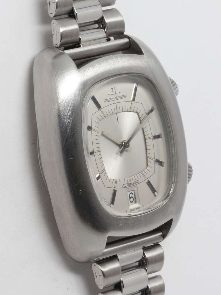 Jaeger-LeCoultre stainless steel automatic cushion wristwatch with alarm, circa 1970s. Oversized case with wide contoured bezel. Very pleasing original silvered satin dial with applied batons and date at 6 o'clock. With period stainless steel heavy