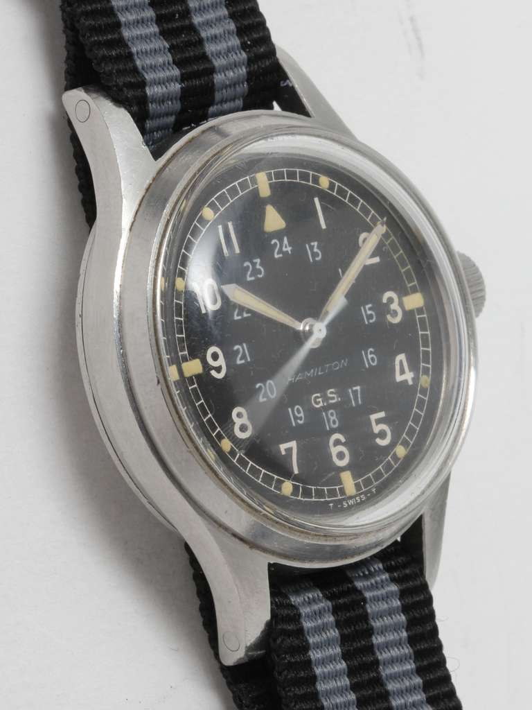 Hamilton stainless steel British military wristwatch, circa 1970s. Large 36mm case with screw back. Original matte black dial with inner 24 hour indications and patinaed tritium luminous dots and hands. Powered by a 17-jewel Swiss calibre S758