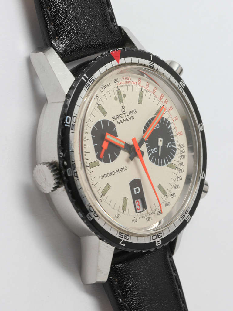 Breitling stainless steel Chrono-Matic chronograph wristwatch with red date, Ref. 2110-15, circa early 1970s. 38.5 mm screw-back case with acrylic crystal, black and silver-tone rotating bezel with both hour and minute elapsed time scales. Striking