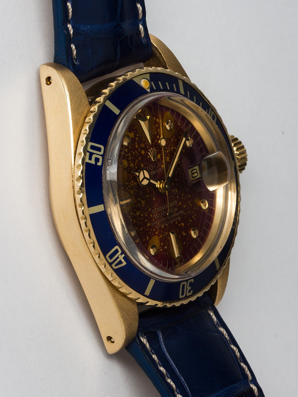 Rolex 18K Yellow Gold Submariner Wristwatch ref 1680 serial #5.8 million circa 1978. 40 mm diameter case with bi-directional elapsed time bezel with original blue insert with antique color pearl and acrylic crystal. Gorgeous and distinctive natural