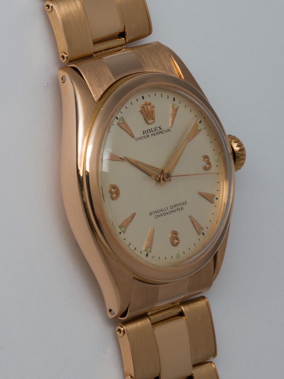 Rolex 18K Rose Gold Oyster Perpetual Wristwatch ref 6084 serial # 794,xxx circa 1952. 34mm diameter case with smooth bezel, acrylic crystal and large Super Oyster crown. Very pleasing restored matte silvered dial with rose gold indexes,  and rose