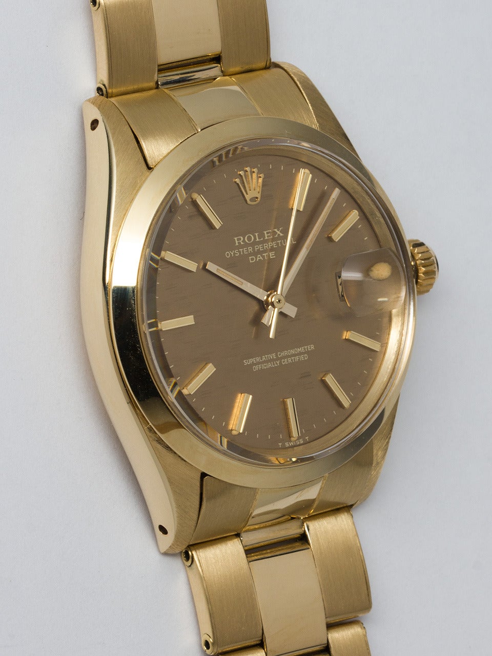 Rolex 14K Yellow Gold Oyster Perpetual Date Wristwatch ref 1501 serial # 3.2 million circa 1972. 34mm diameter case with smooth bezel and acrylic crystal. Lovely original bronze fine linen texture dial with gold applied indexes and gold baton hands.