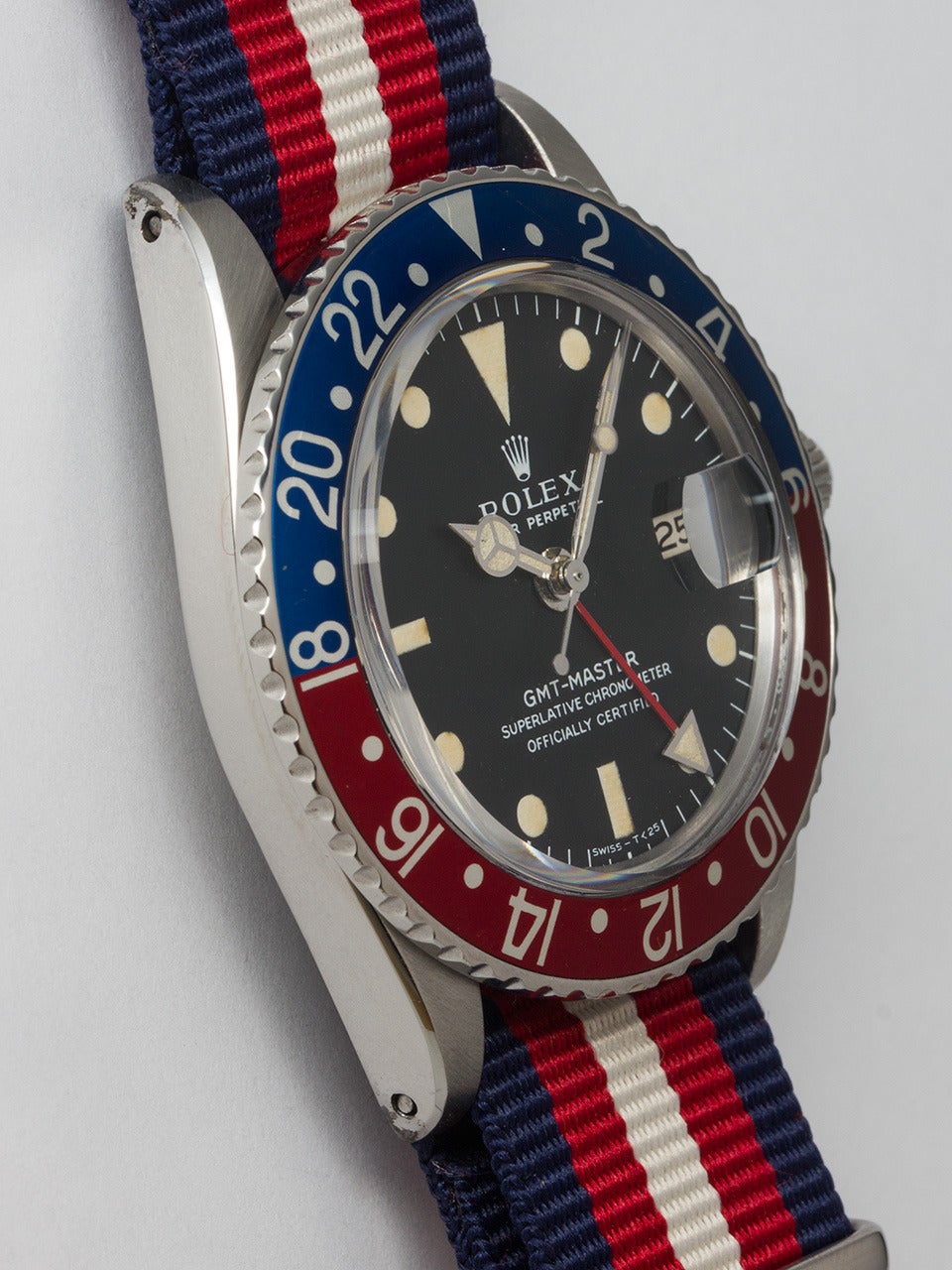 Rolex Stainless Steel GMT-Master Wristwatch, ref 1675 serial # 2.9 million circa 1971. 40mm diameter case featuring red and blue, so called Pepsi bezel and acrylic crystal. Original matte black dial with light ivory luminous indexes and matching