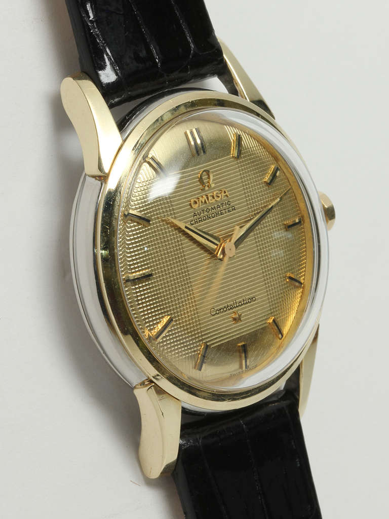 Omega gilt top and stainless steel back Constellation wristwatch with automatic movement, Ref. 14381 61 SC, movement serial number 17.9 million, circa 1960. 34 X 43.5mm case with extended lugs, acrylic crystal and signed Omega crown. Beautiful and