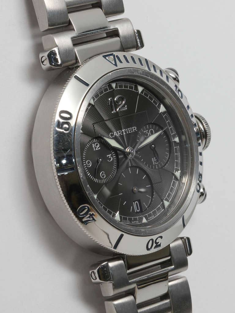 Cartier stainless steel Pasha automatic chronograph wristwatch, Ref. 2113, circa 1990s. 38 x 44.5mm case with rotating bezel, cabochon sapphire chronograph pushers and canteen-style crown. Beautiful original textured gray dial. Self-winding movement